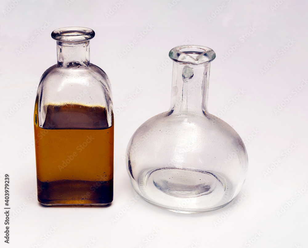 Bottle of olive oil surrounded by white background Bottle of olive oil surrounded by white background