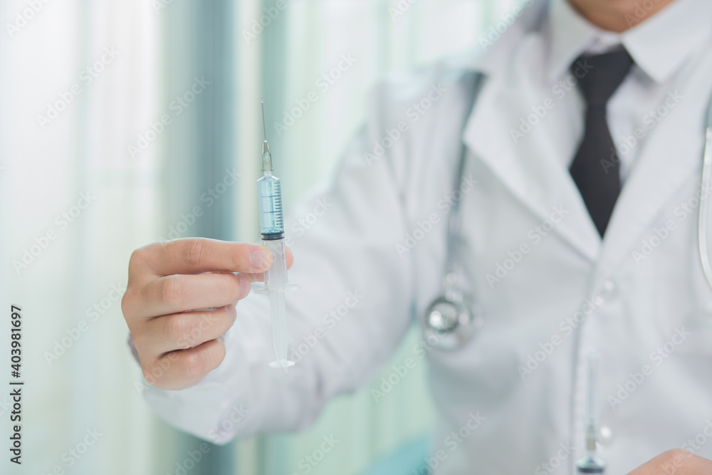 Doctor in mask taking vaccine with syringe
Doctor in mask taking vaccine with syringe
