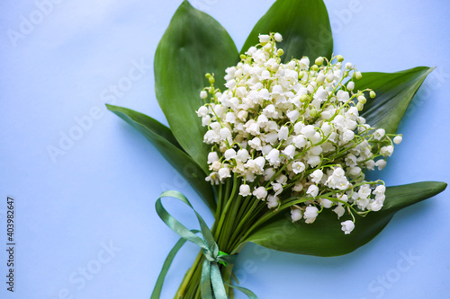 mockup greeting card. spring composition. bouquet of lilies of the valley and space for text. congratulation. invitation