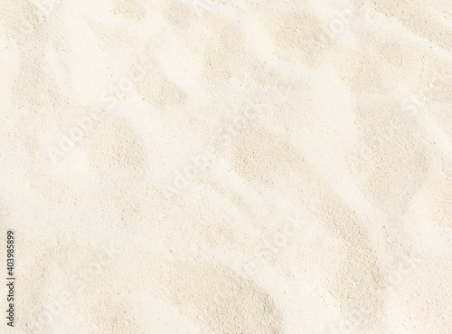 Summer background. Texture of sandy golden beach. White sand of tropical beach close-up.