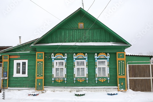 Vintage wooden rural house with ornamental windows, carved frames in Nerekhta town, Kostroma region, Russia. Russian folk style in architecture. Village. Landmark photo