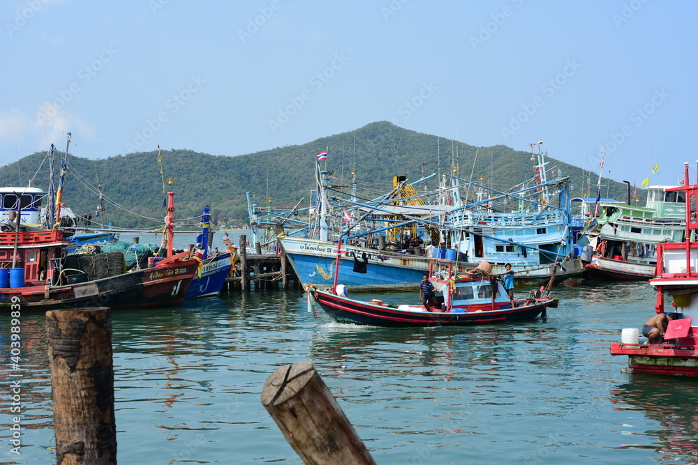 View of the fishing port overlooking the boat and Pattaya city. Which is a large city close to local fishing sources in Thailand	