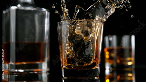 Ice Cube falling into Glass...