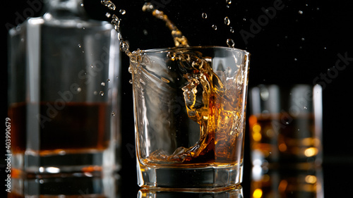 Ice Cube falling into Glass...