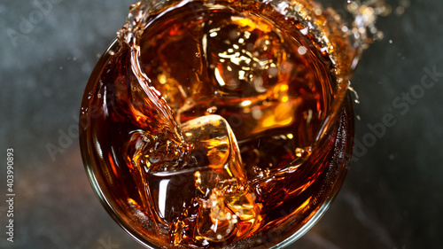 Ice Cube falling into Glass...