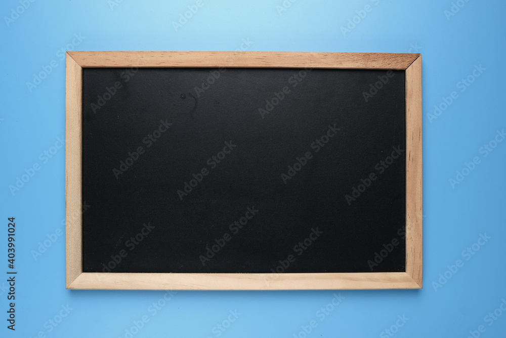 A picture of copyspace blackboard on blue background. A picture of copyspace blackboard on blue background.