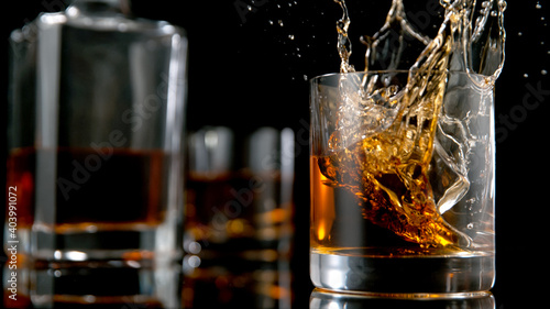 Ice Cube falling into Glass...