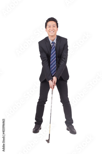 Business man holding golf swing and smiling at the camera