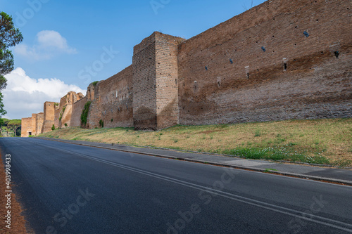 Detail of the Aurelian defensive walls from here passed the Via Appia, the regina viarum, on a summer day with blue sky. Close to the Baths of Caracalla and the Circus Maximus in Rome, Lazio, Italy.
