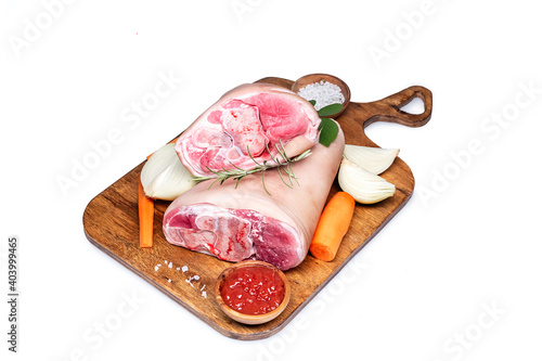 Raw pork knuckle with rosemary photo