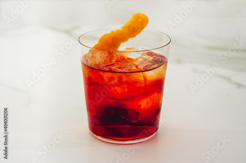 Negroni Cocktail with an Orange Twist in a Tumbler, made with Gin, Red Vermouth and Bitter