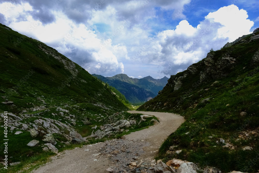 curvy road between mountains in the summer curvy road between mountains in the summer