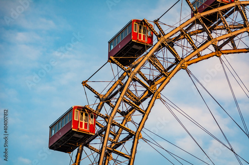 Historic Ferris wheel of the famous Vienna Prater Park with its wooden red carriages. One of the main sighting points in Vienna, Austria 