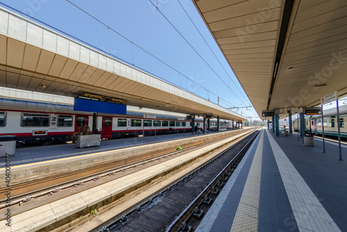 Railway station with train waiting on the tracks © giadophoto