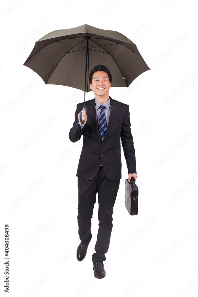 Young businessman holding black umbrella and portfolio Young businessman holding black umbrella and portfolio