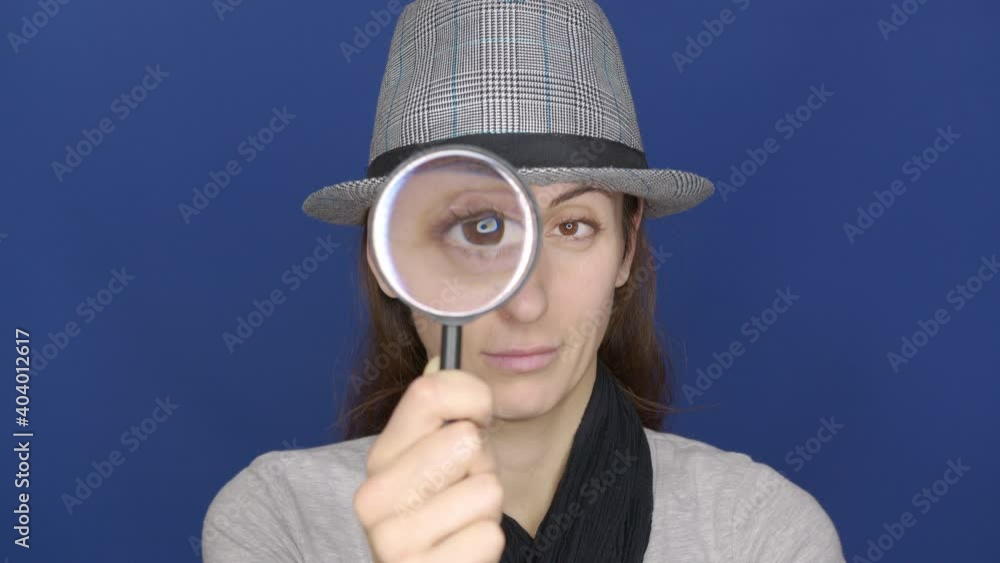 Funny girl looking throw Magnifier to the Camera . Trendy red-haired Woman having fun. Colorful Portrait. Beautiful Girl. Funny Frame. Amazing Eyes. Closeup. Funny girl looking throw Magnifier to the Camera . Trendy red-haired Woman having fun. Colorful Portrait. Beautiful Girl. Funny Frame. Amazing Eyes. Closeup.