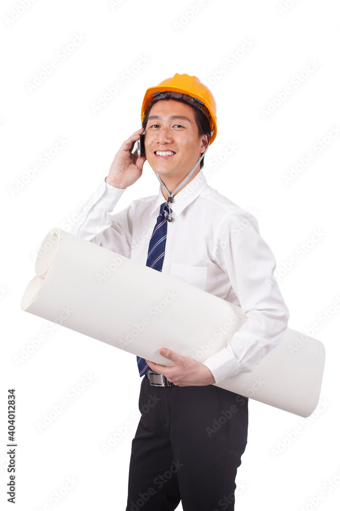 Construction management holding blueprints and using phono Construction management holding blueprints and using phono