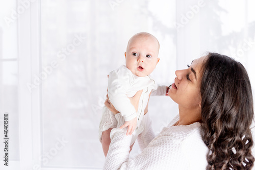 mother with baby  family  concept of a happy young family with a small child  lifestyle  mother s day