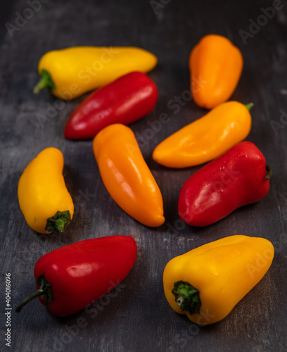 Assorted ripe multi-colored baby peppers, red, orange and yellow, France