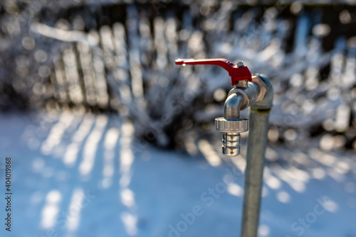 Cuadro en lienzo Closed garden water tap close up shot at wintertime , beautiful winter light, space for text