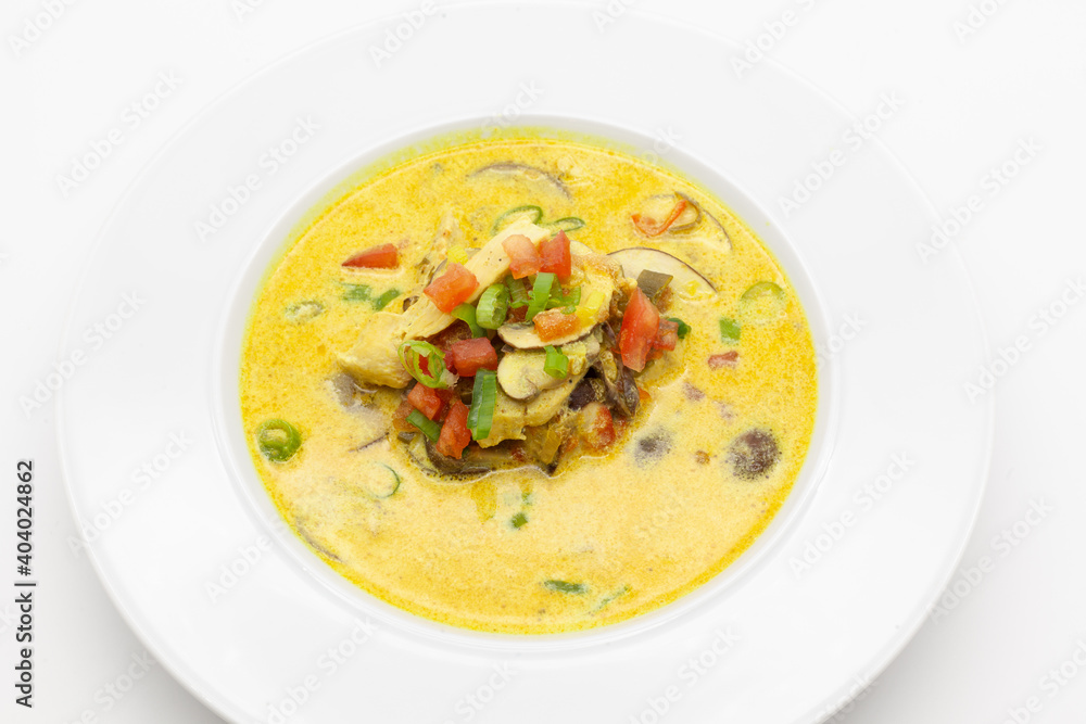 Low carb Curry soup with chicken, coconut milk, champignons, and chilli pepper.