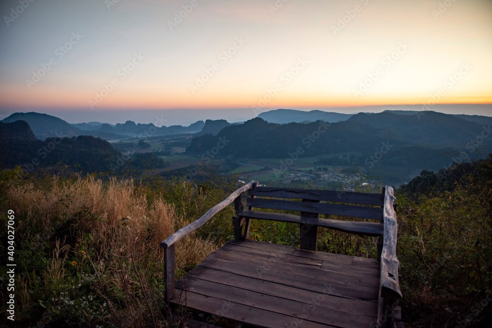 Landscape beautiful sky mountain scenery view on hill sunset or sunrise with wooden terrace view point.