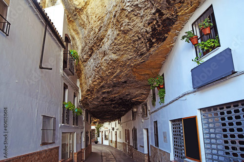 Curious and surprising street of Setenil de las Bodegas, where their houses are under a large giant rock, Cadiz, Andalusia, Spain photo