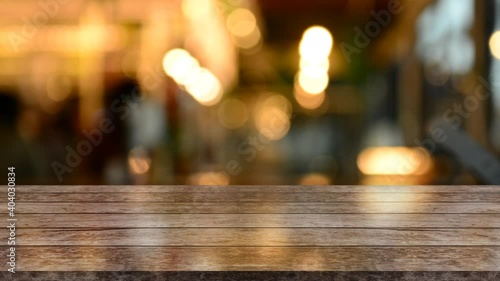 Empty wood top table with blur restaurant background.