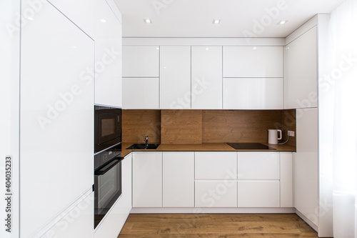 Interior photography  large white kitchen studio in a modern style  minimalism