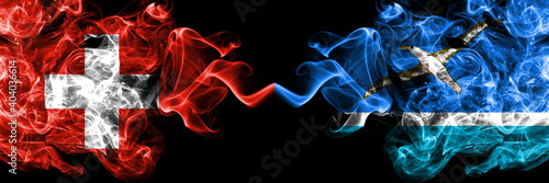 Switzerland, Swiss vs United States of America, America, US, USA, American, Midway Islands smoky mystic flags placed side by side. Thick colored silky abstract smoke flags.