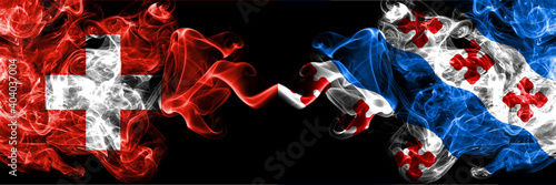 Switzerland, Swiss vs United States of America, America, US, USA, American, Rockville, Maryland smoky mystic flags placed side by side. Thick colored silky abstract smoke flags.