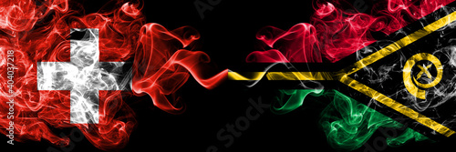 Switzerland, Swiss vs Vanuatu smoky mystic flags placed side by side. Thick colored silky abstract smoke flags.
