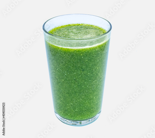 Healthy food and drink concept. New years resolution. A glass of green smoothy juice isolated on white background, space for copy
