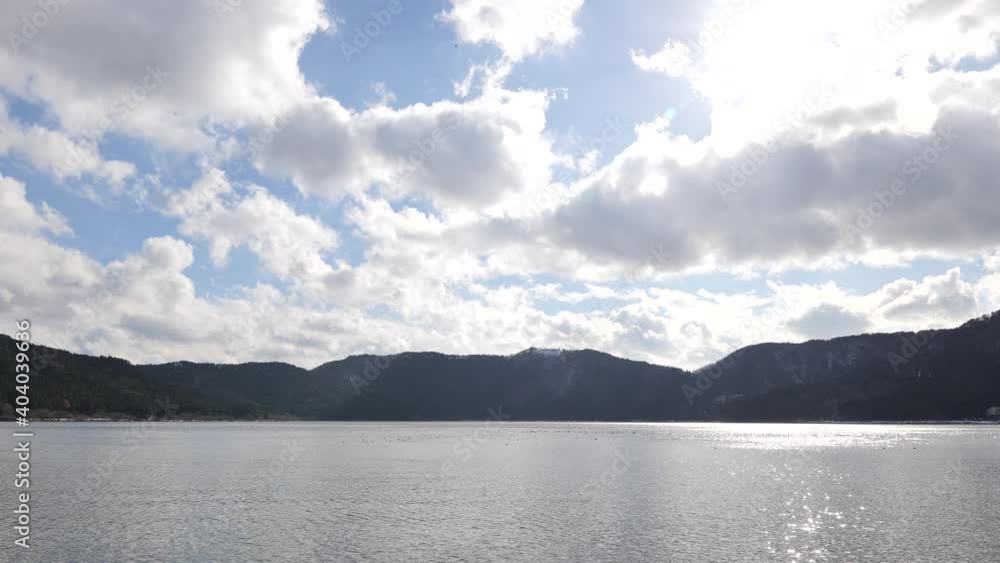 Nagahama, Shiga Prefecture, on a clear winter day, with blue sky and Lake Yogo shrouded in clouds. Nagahama, Shiga Prefecture, on a clear winter day, with blue sky and Lake Yogo shrouded in clouds.