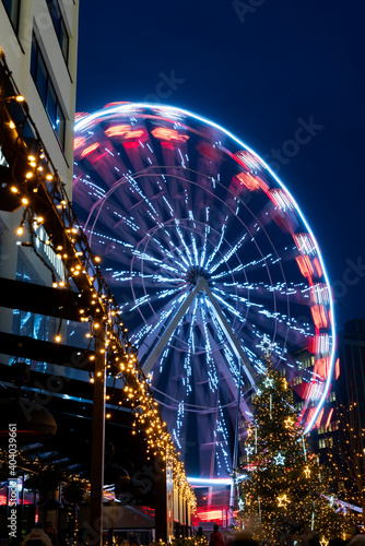 Christmas time in a city with ferris wheel. December 22, 2020. Zlin, Czech Republic.