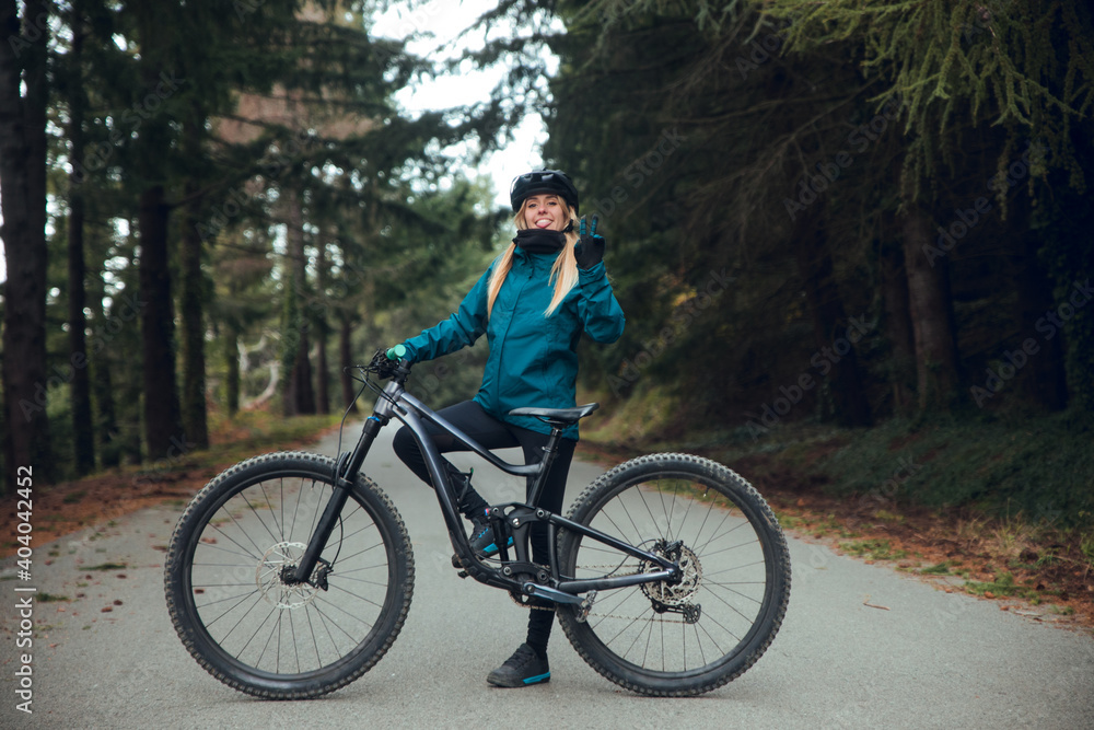 Close up of Cyclist girl with mountain bike in forest Close up of Cyclist girl with mountain bike in forest