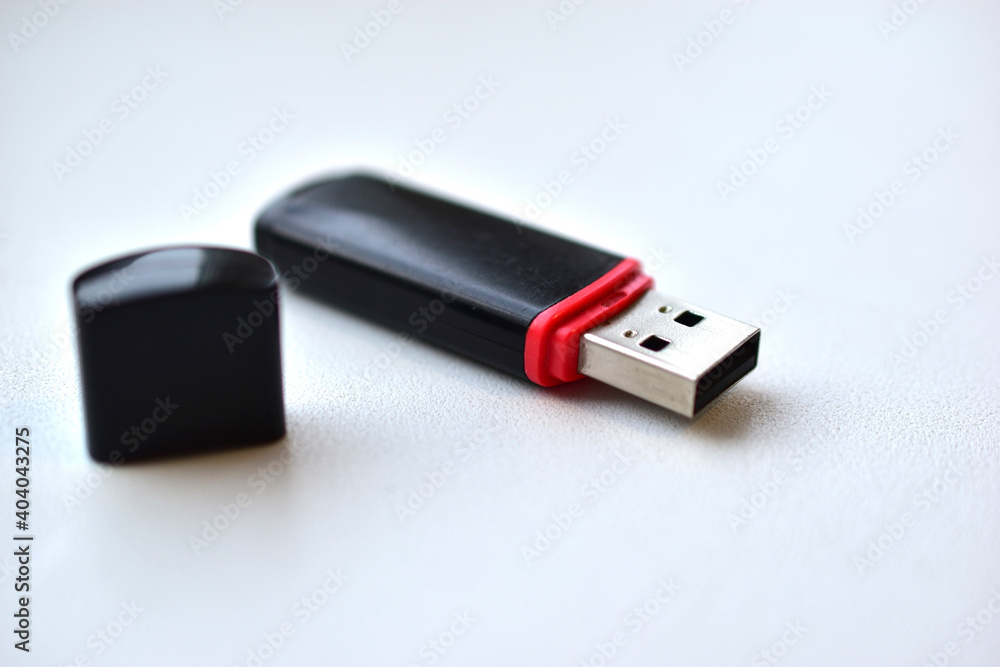 Black flash drive on a white background Black flash drive on a white background