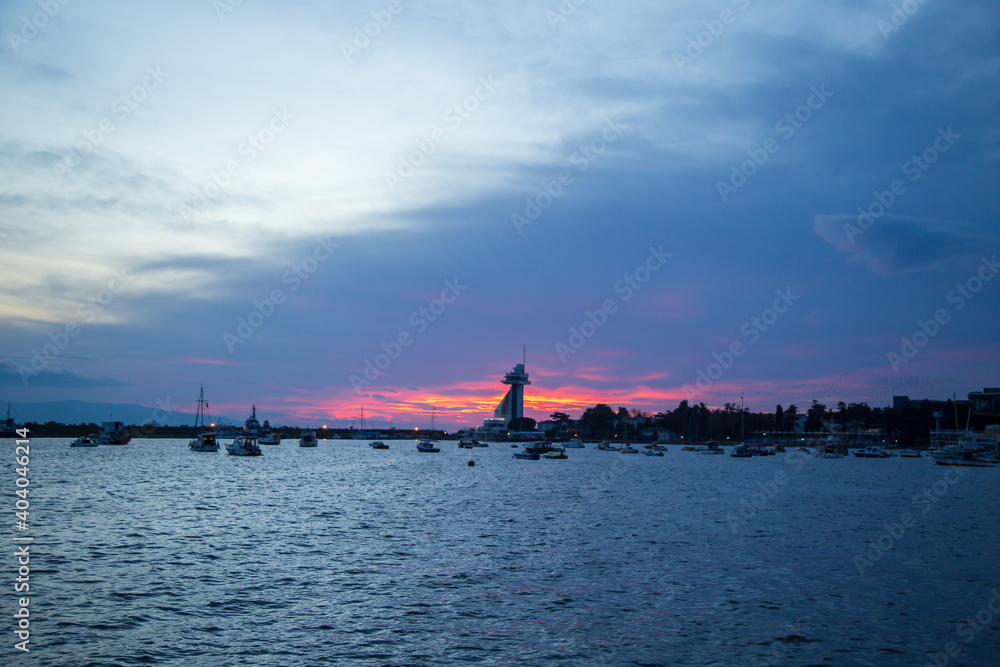 amazing sunset view colorful sky. boats and seagulls ready to sail