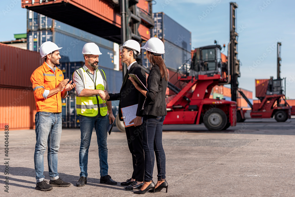group of businessman, Logistics engineer and inspector and businessman walking and discussing about business deal and project in shipping containerin commercial transport port