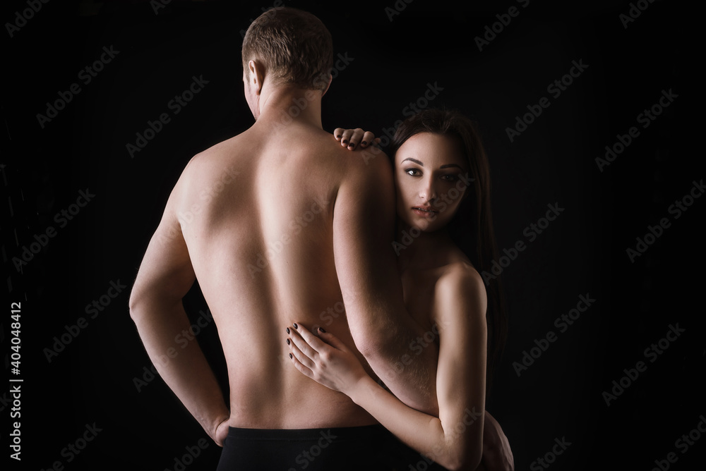 naked couple in lingerie guggs on black background. Sensual relationships naked couple in lingerie guggs on black background. Sensual relationships