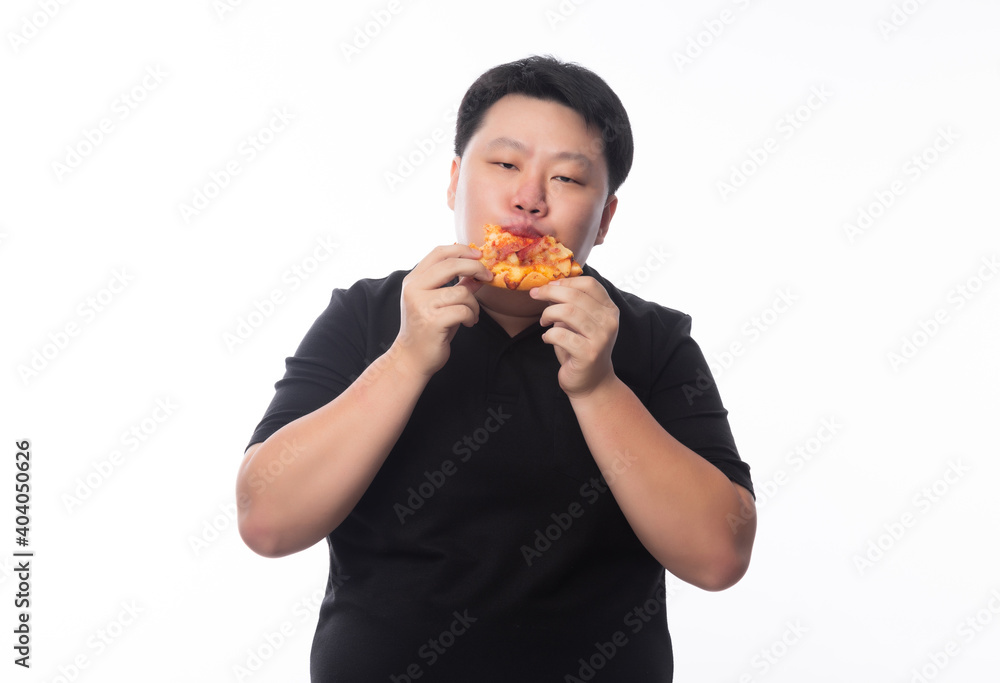 Young Funny Fat Asian man eating hawaiian pizza isolated on white background, Unhealthy concept. Young Funny Fat Asian man eating hawaiian pizza isolated on white background, Unhealthy concept.