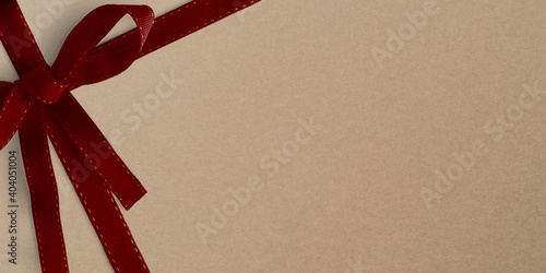 red ribbon with bow on brow...