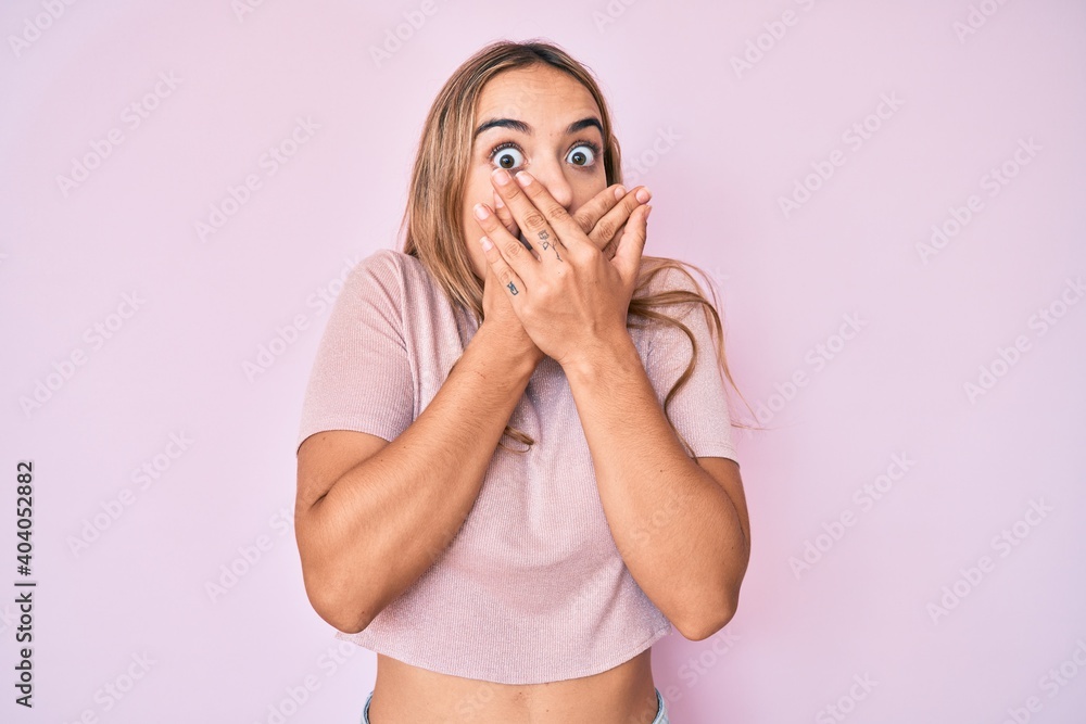 Young beautiful blonde woman wearing casual clothes shocked covering mouth with hands for mistake. secret concept. Young beautiful blonde woman wearing casual clothes shocked covering mouth with hands for mistake. secret concept.