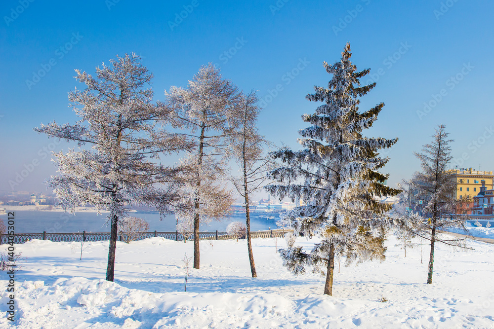 Fototapeta premium landscape of Irkutsk city of Russia during winter season,church and tree are cover by snow.It is very beautiful scene shot for photographer to take picture.Winter is high season to travelling Russia 