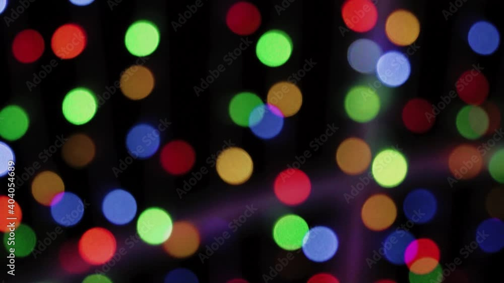 Blurry image of colored lights on a black background Blurry image of colored lights on a black background