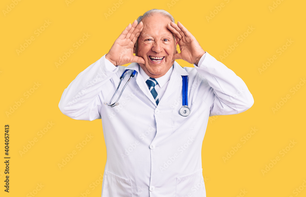 Senior handsome grey-haired man wearing doctor coat and stethoscope smiling cheerful playing peek a boo with hands showing face. surprised and exited Senior handsome grey-haired man wearing doctor coat and stethoscope smiling cheerful playing peek a boo with hands showing face. surprised and exited