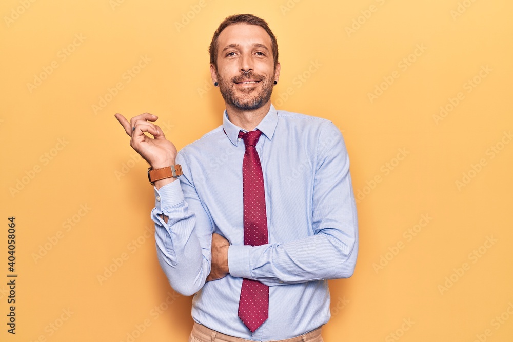 Young handsome man wearing business clothes smiling happy pointing with hand and finger to the side Young handsome man wearing business clothes smiling happy pointing with hand and finger to the side