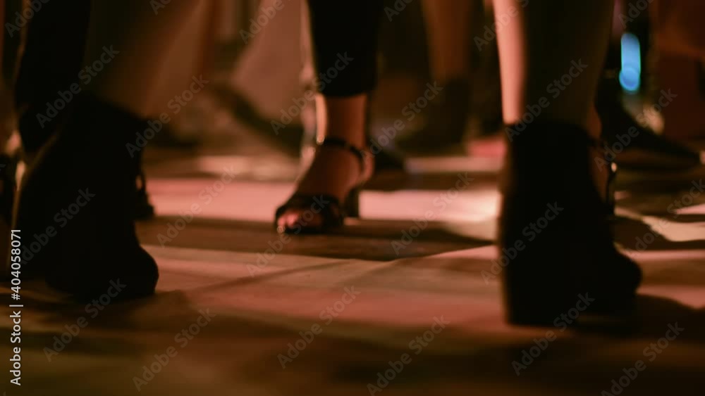 Bottom view, people are dancing on the dance floor. Bottom view, people are dancing on the dance floor.