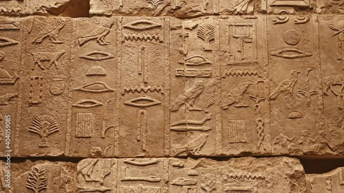 Stone wall with ancient Egyptian hieroglyphs
