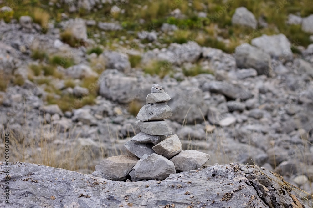 A set of stones stacked in a mountain path (Marche, Italy, Europe)